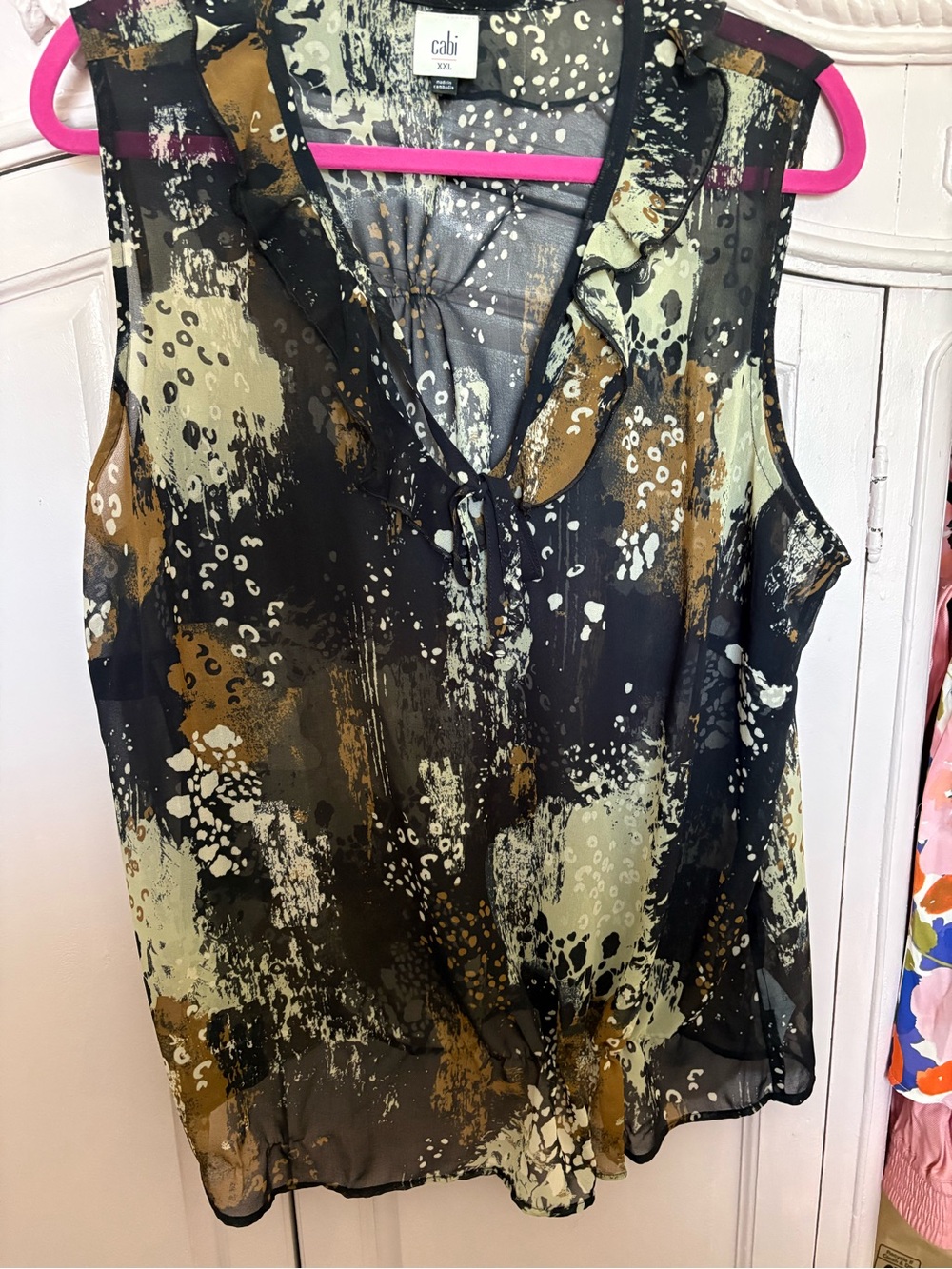 CAbi Sleeveless V-Neck Ruffle Tie Blouse in Black, Olive and Brown